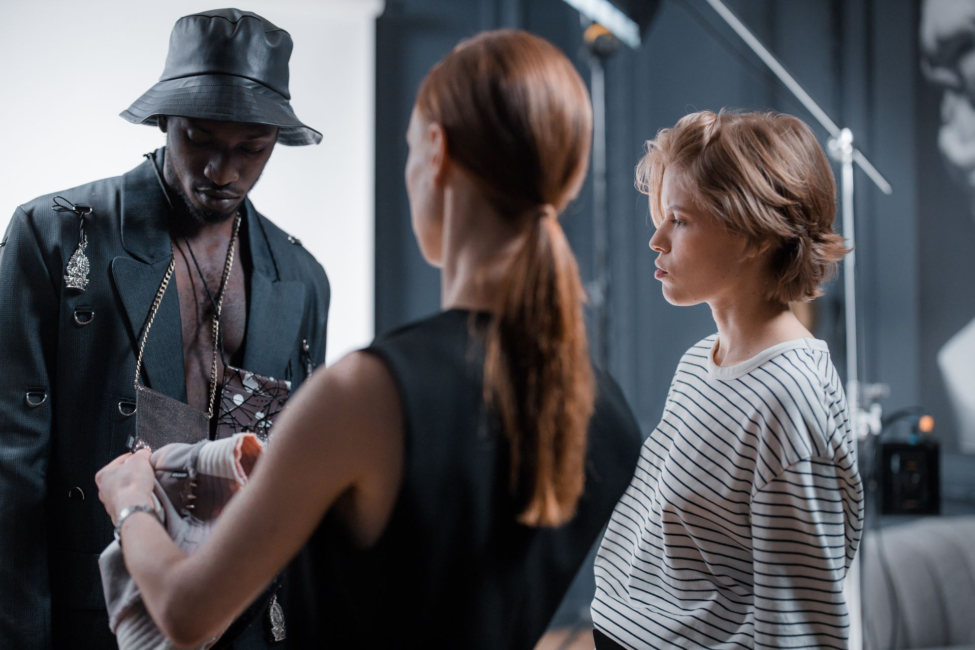Illustrative fashion team preparing a studio shoot